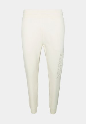 Ljusgrå joggers med en mjuk textur, som har ett figursytt midjeband och smalnande ben. Subtil präglad logotyp på vänster ben.