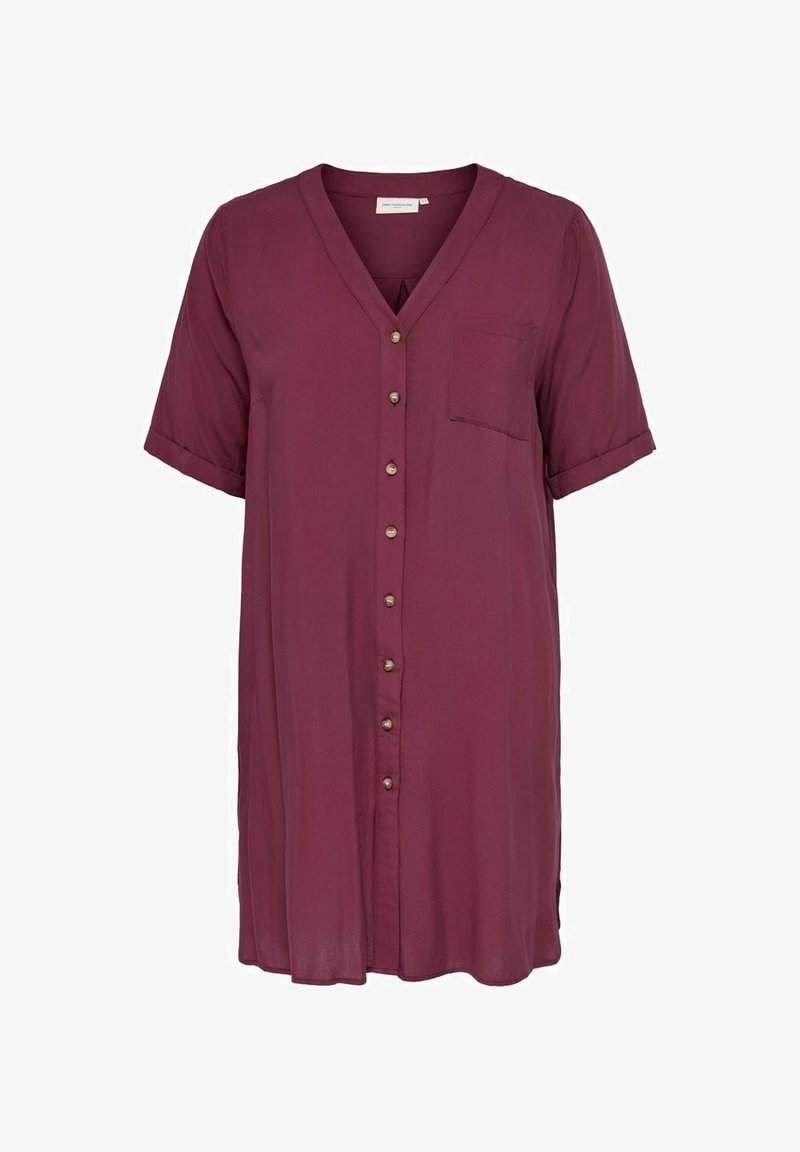 Camicia bordeaux con colletto a V, maniche corte, taschino singolo e tessuto liscio e leggero. Presenta bottoni decorativi in metallo.