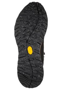Schwarze Gummisohle mit aggressivem Profil, ausgestattet mit gelbem Vibram-Logo, strukturierte Oberfläche mit verstreuten weißen Sprenkeln für besseren Halt.