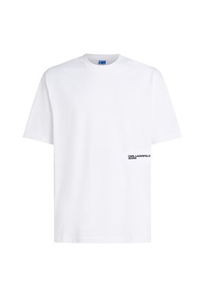 Balta kokvilnas T-krekls ar apaļu izgriezumu un īsām piedurknēm. Pēc tam ir melns "KARL LAGERFELD JEANS" logo kreisajā pusē.