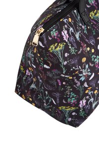 Floral-patterned black bag made of fabric, featuring a gold zipper, with varying colorful flowers and natural elements across the surface.