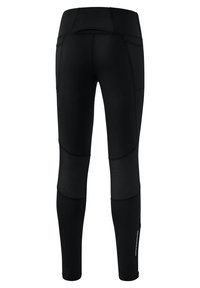 Leggings noirs en tissu extensible, dotés de panneaux en maille, d'accents cousus et d'une taille haute avec un petit détail de poche à l'arrière.