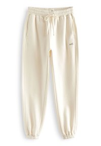 Cremfarbene Jogginghosen aus weichem Material mit elastischem Bund, verstellbarem Kordelzug, Seitentaschen und schmalen Bündchen.