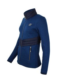 Giacca blu navy con zip, caratterizzata da un corpo testurizzato, fascia inferiore trapuntata e due tasche laterali con zip per una funzionalità aggiuntiva.