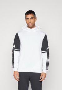 Weißer Hoodie mit schwarzen Ärmeln. Verfügt über drei schwarze Streifen an den Ärmeln und Akzent-Logos. Weicher Stoff, lässiges Design und verstellbare Kapuze.