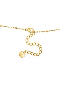 Bracciale in oro con chiusura a moschettone, caratterizzato da maglie di diverse dimensioni e un ciondolo circolare inciso con il marchio.