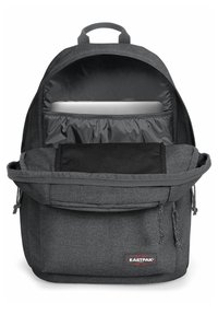Gray fabric backpack with a zippered main compartment, padded laptop sleeve, front pocket, and drawstring accents at the sides.