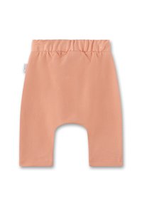 Pfirsichfarbene Baumwollshorts mit einem elastischen Bund, die eine glatte, strukturierte Oberfläche aufweisen und keine sichtbaren Muster oder Beschläge haben.