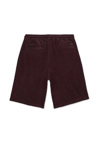 Shorts en velours côtelé marron foncé pour homme, avec taille élastique et deux poches passepoilées à l'arrière, dont une avec une petite étiquette de la marque.