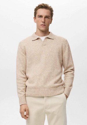 Jersey de punto beige con cuello tipo camisa y puños acanalados. Fabricado en un material texturizado, presenta un diseño de corte relajado.