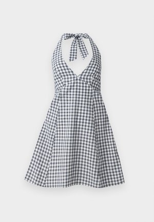 Niebiesko-biała sukienka halter w kratkę o głębokim dekolcie i wiązaniu z tyłu. Żakardowy krój spódnicy z dopasowaną górą i detalami w postaci fałd.