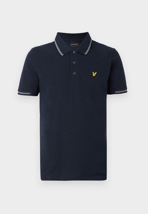 Polo shirt marine à manches courtes en coton, avec un col rayé gris et une patte de boutonnage à trois boutons, ainsi qu'un logo jaune sur la poitrine.