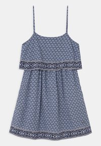 Blue patterned dress with spaghetti straps, featuring a geometric design and navy border. Made of lightweight fabric, gathered at the waist.