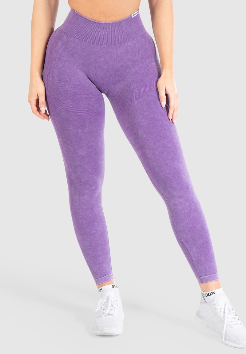 Leggings viola a vita alta con una finitura morbida e testurizzata. Presentano dettagli a costine sulla vita e un aspetto aderente e liscio.