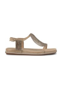 Tan flat sandal with a T-strap design, embellished with metallic accents and a textured fabric band, featuring an adjustable ankle strap.