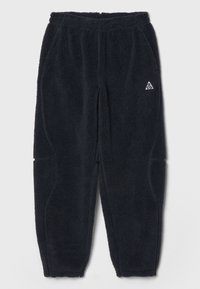 Svarta fleecebyxor med resårmidja, sidofickor och strukturerad tyg, med en liten vit triangel-logotyp framtill.