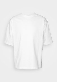 T-shirt unisexe blanc à manches courtes avec col rond, coupe ample, présenté sur un fond clair uni.