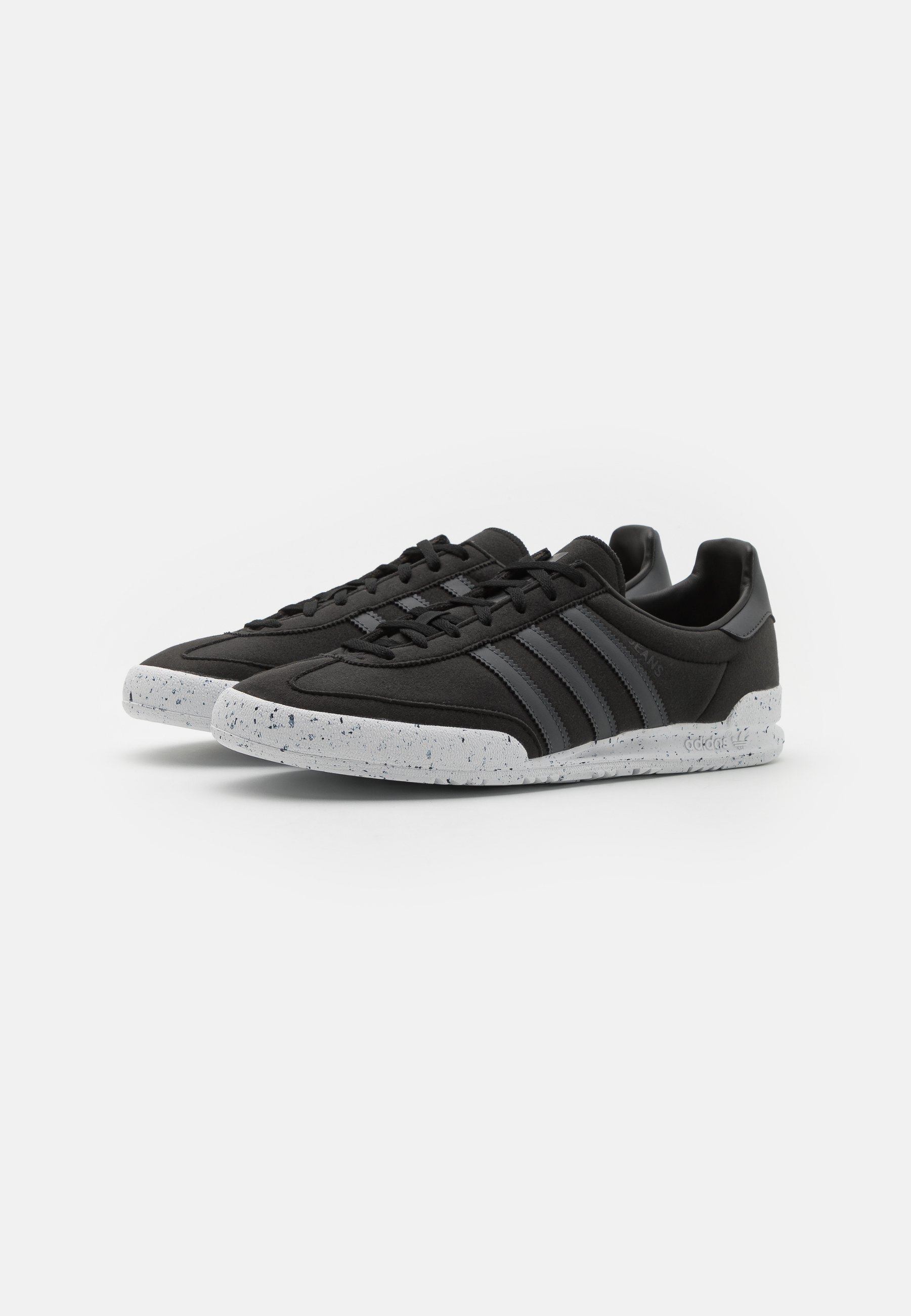 black adidas trainers with white sole