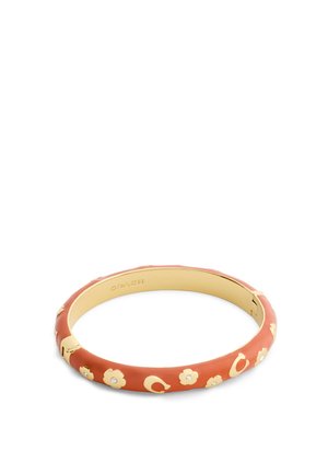 Goudkleurige armband met burnt orange emaille coating, versierd met kleine gouden bloemen en ingelegde kristallen, scharnierende sluiting, Coach-logo aan de binnenkant.