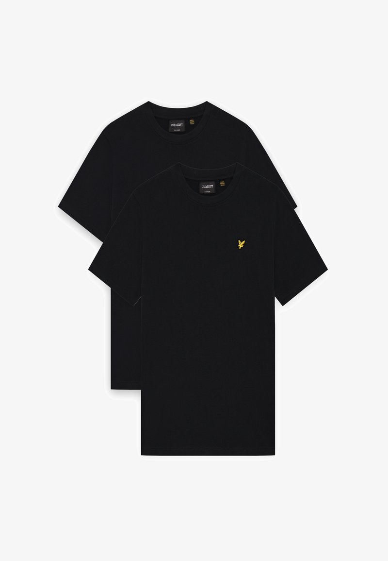 Deux t-shirts noirs unis à manches courtes et col rond, l'un superposé derrière l'autre, avec un petit logo d'oiseau jaune sur la poitrine avant.
