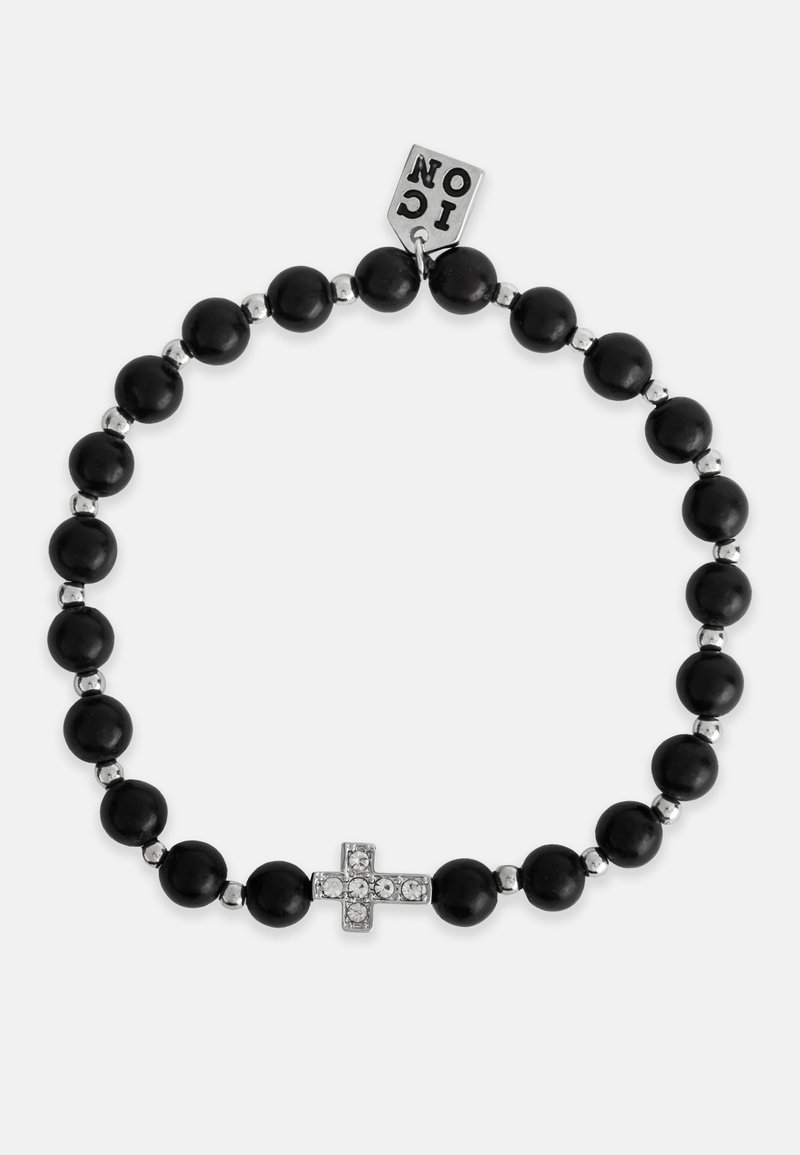 Brăță din mărgele negre, cu accente de argint și un centru în formă de cruce împodobit cu cristale. Include un mic eticheta metalică.
