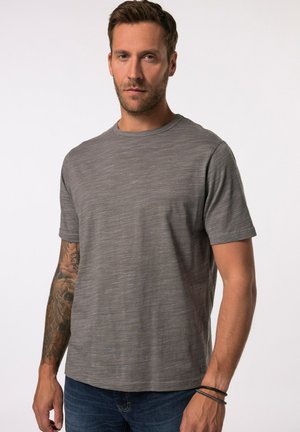 Gray short-sleeve t-shirt with a subtle textured pattern, round neckline, and a straight hem. Worn with dark jeans and visible tattoos.