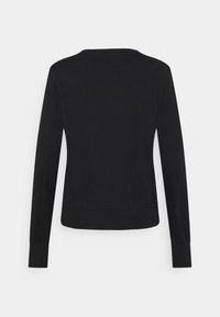 Musta pitkähihaisen poolopaita pyöreällä kaula-aukolla, pehmeä tekstuuri, resorit hihansuissa ja helmassa. Yksinkertainen, hillitty muotoilu ilman näkyviä kuvioita tai koristeita.