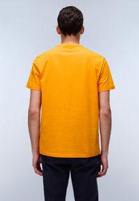 Yellow cotton t-shirt featuring a round neck and short sleeves, displayed from the back. Seam and hem details are visible.