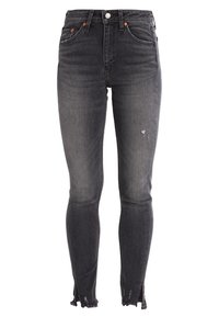 Jeans ajustados de tiro alto en gris oscuro con ligero desgastado en el muslo y dobladillos deshilachados con aberturas en la parte delantera.