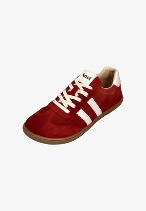 Red suede sneaker with white stripes, white laces, and a beige rubber sole. Features a rounded toe and a logo on the tongue.