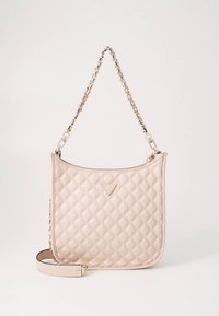 Quilted beige handbag with chain strap, featuring a gold logo accent, smooth texture, and a structured, rounded shape.