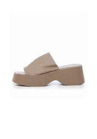 Beige platform sandaler med en bred stofrem og en bølget, formet plastik sål for øget komfort og stil.