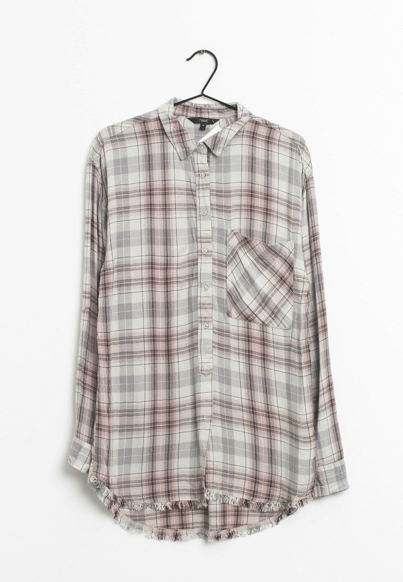 Checked long-sleeve shirt in gray, pink, and white. Features a collar, six buttons, a chest pocket, and a frayed hem at the bottom.