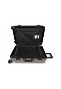 Hard-sided luggage in gray with a black interior. Features a mesh pocket, rolling wheels, and a retractable handle. Opened for packing.