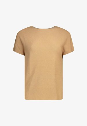 Haut en maille beige à manches courtes avec un col rond et une coupe ample et carrée.