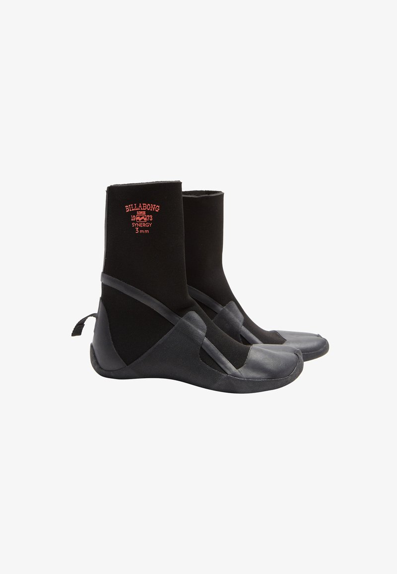 Black wetsuit boots with a neoprene upper, rubber sole, reinforced stitching, and a strap across the midfoot. Billabong logo on the front.