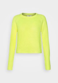Neon żółty sweter z dzianiny z okrągłym dekoltem, długimi rękawami raglanowymi i krótkim krojem. Lekka tekstura z prążkowanymi detalami.