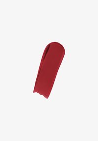 Accesorio de tela roja con una textura suave, forma alargada y una ligera curva en un extremo. Sin patrones visibles ni detalles de hardware.