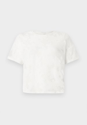 Λευκό τοπ με κοντά μανίκια από υφασμάτινη δαντέλα, με στρογγυλή λαιμόκοψη και λουλουδάτο μοτίβο σε όλο το ύφασμα. Κοντή σχεδίαση.