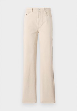 Beežid teksapüksid, millel on sirge ja laienev lõige, sujuva tekstuuriga, ees nupuga kinnitamine, kaks eesmist taskut ja peened tõmblukkude detailid.