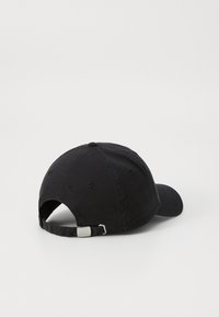 Black cotton baseball cap with a curved brim, adjustable strap at the back, and a smooth texture. No visible logos or patterns.