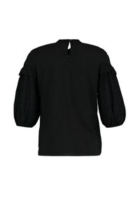 Blouse noire avec manches trois-quarts bouffantes et détail à volants près des épaules, fermeture par boutons au niveau de la nuque.