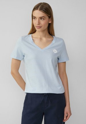 Light blue striped T-shirt with a v-neck and short sleeves. Features a small white circular logo on the left chest area. Soft fabric.