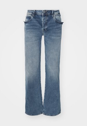 Vervaagde blauwe wijde jeans van denim stof, voorzien van een knoop- en ritssluiting, vijf zakken en een licht rafelige zoom.