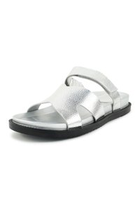 Silver textured open-toe sandal with black sole and adjustable ankle strap, designed for casual wear.