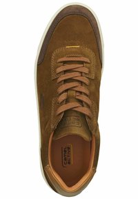 Brown suede sneaker with round toe, lace-up design, leather accents, perforated detailing, and a beige rubber sole. Interior features logo.