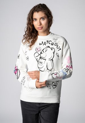 Weißer Pullover mit einem grafischen Cartoon-Bear, handgeschriebenem Text und bunten Kritzeleien. Weiches Material mit gerippten Bündchen und Saum. Lässige Passform.