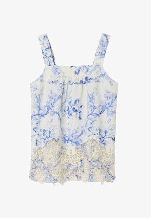 Baltas be rankovių viršus su mėlynu gėlių raštu ir sudėtinga kreminės spalvos nėrinių apdaila apačioje, plačiomis petnešomis.