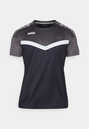 T-shirt de sport à manches courtes en gris foncé et noir, avec un design en chevron blanc, un dessus texturé et le logo Jako sur le devant.