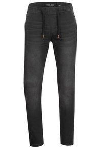 Pantalons jogger en denim noir avec une taille élastique, cordon de serrage et jambes fuselées. Texture lisse et léger délavage sur l'ensemble du tissu.